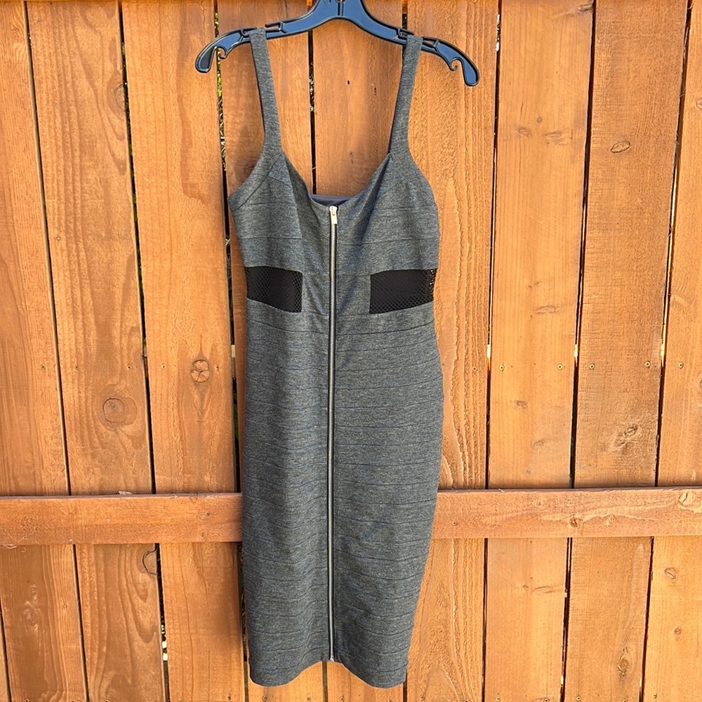 This MIDI dress is so flattering. It has a front zipper with a black mesh